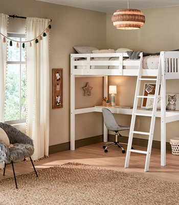 White, lofted bed with desk beneath it. Villa Grey walls and contrasting sage green trim complete the look.