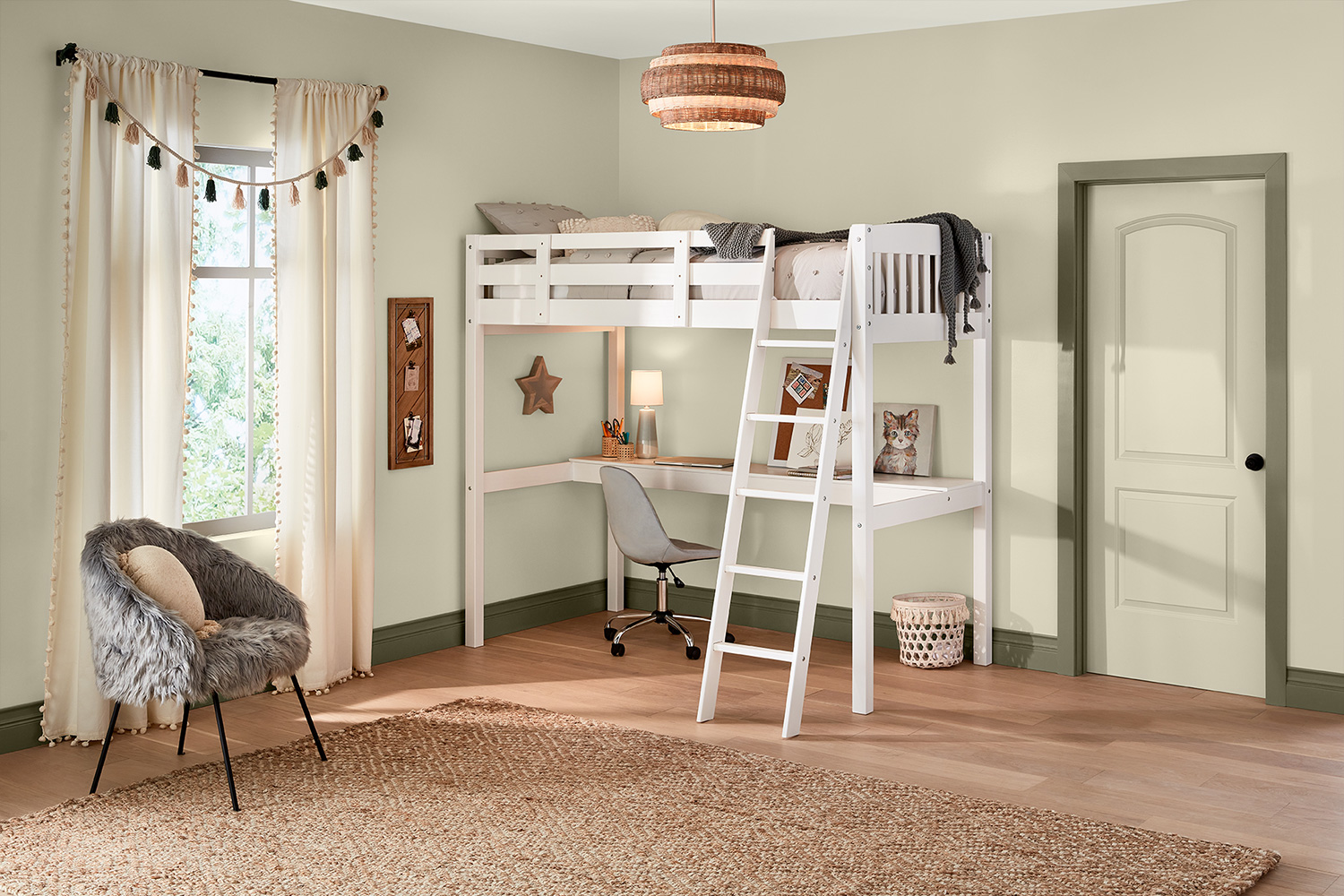 White, lofted bed with desk beneath it. Villa Grey walls and contrasting sage green trim complete the look.